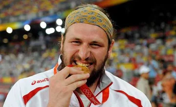 Tomasz Majewski, zdobył pierwsze złoto dla polskiej reprezentacji w Pekinie, fot. PAP