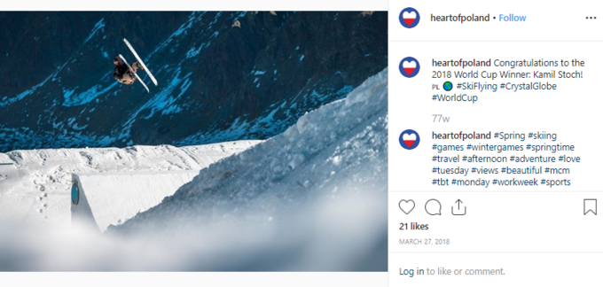 PFN gratuluje Kamilowi Stochowi. Na zdjęciu widać narciarza wykonującego powietrzną akrobację