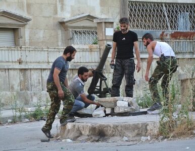 Miniatura: Bombowce Asada bombardują Aleppo - bomby...