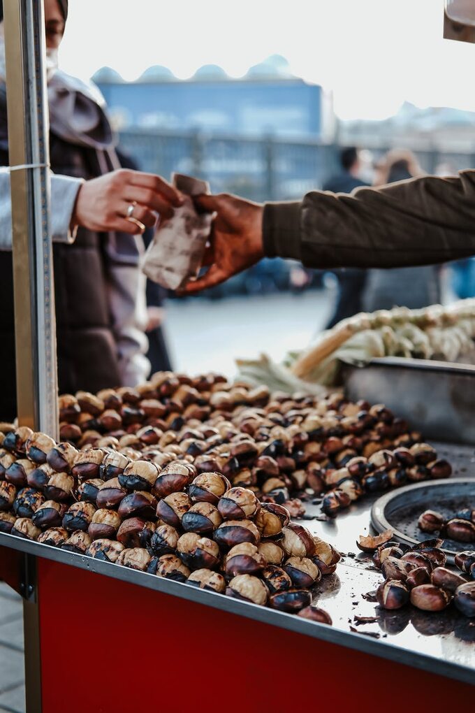 Woman Buying Chestnuts