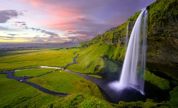 Islandia Idyllic landscape with a waterfall