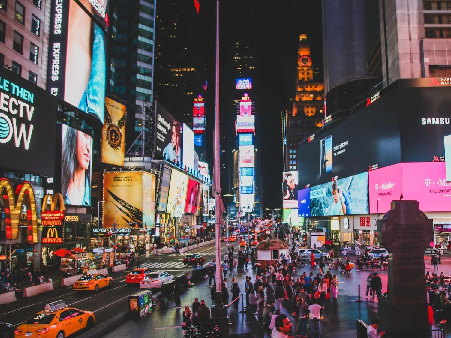 People Walking on Street during Night Time