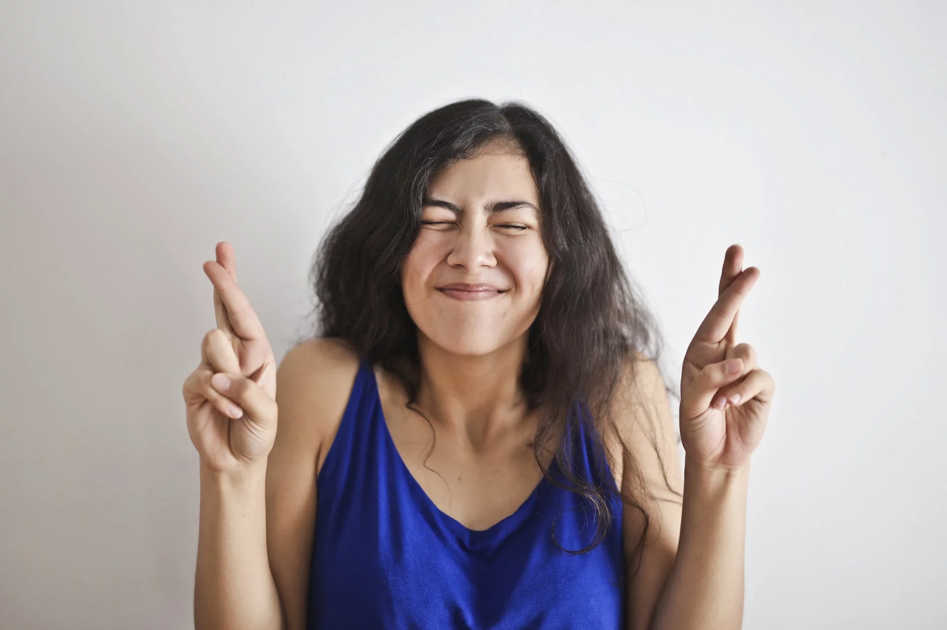 Woman in Blue Tank Top Smiling