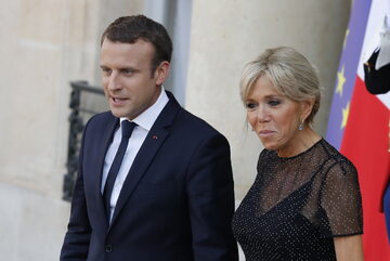 Emmanuel Macron z małżonką