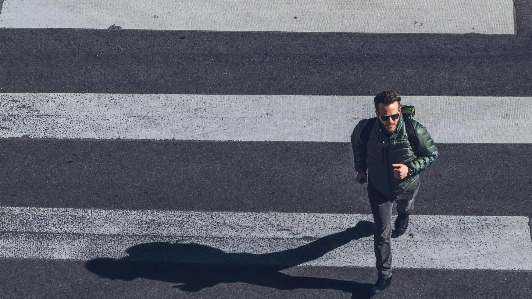 Man Crossing on Pedestrian Lane