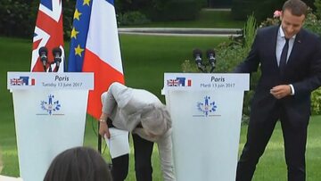 May loses her papers seconds into press conference with Macron