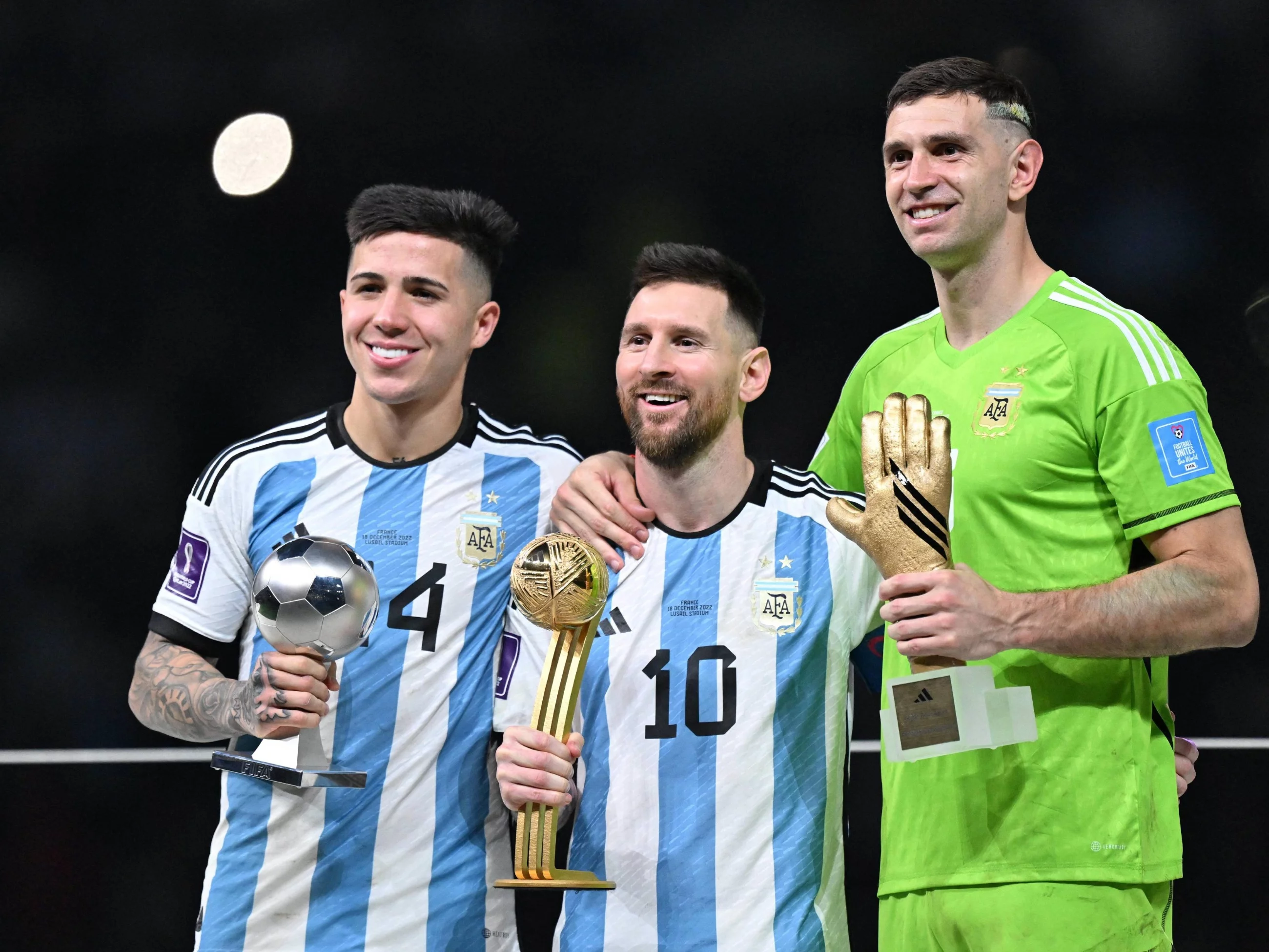 Enzo Fernandez, Lionel Messi, Emiliano Martinez