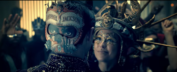 Screen z teledysku "Behind the Mask"